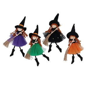 Witch decoration with ginger hair and broom