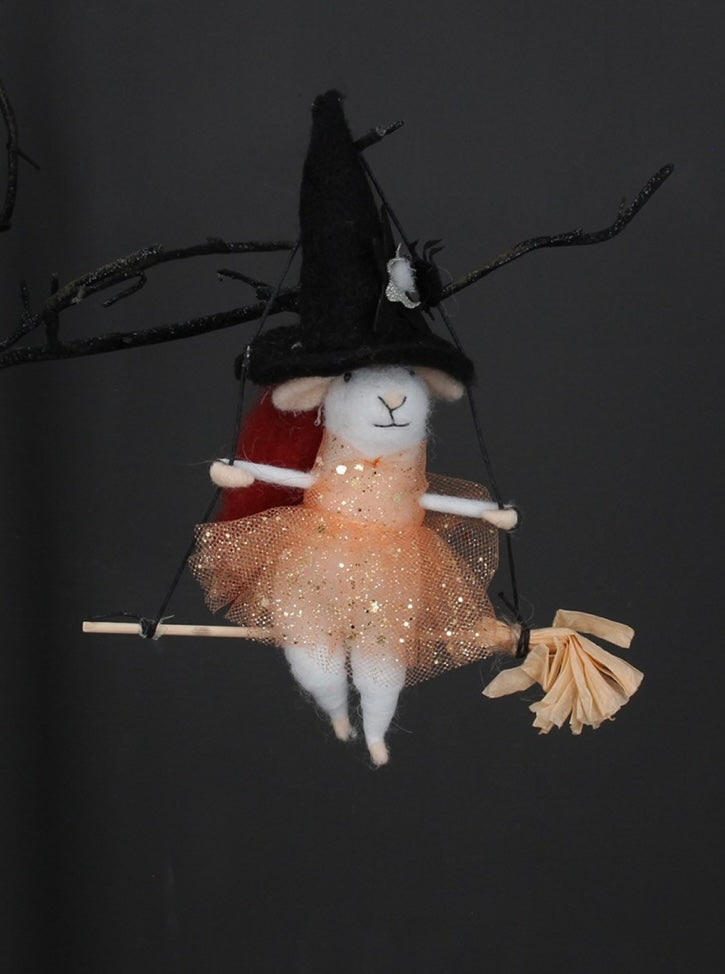 Hanging witch mouse on a broom